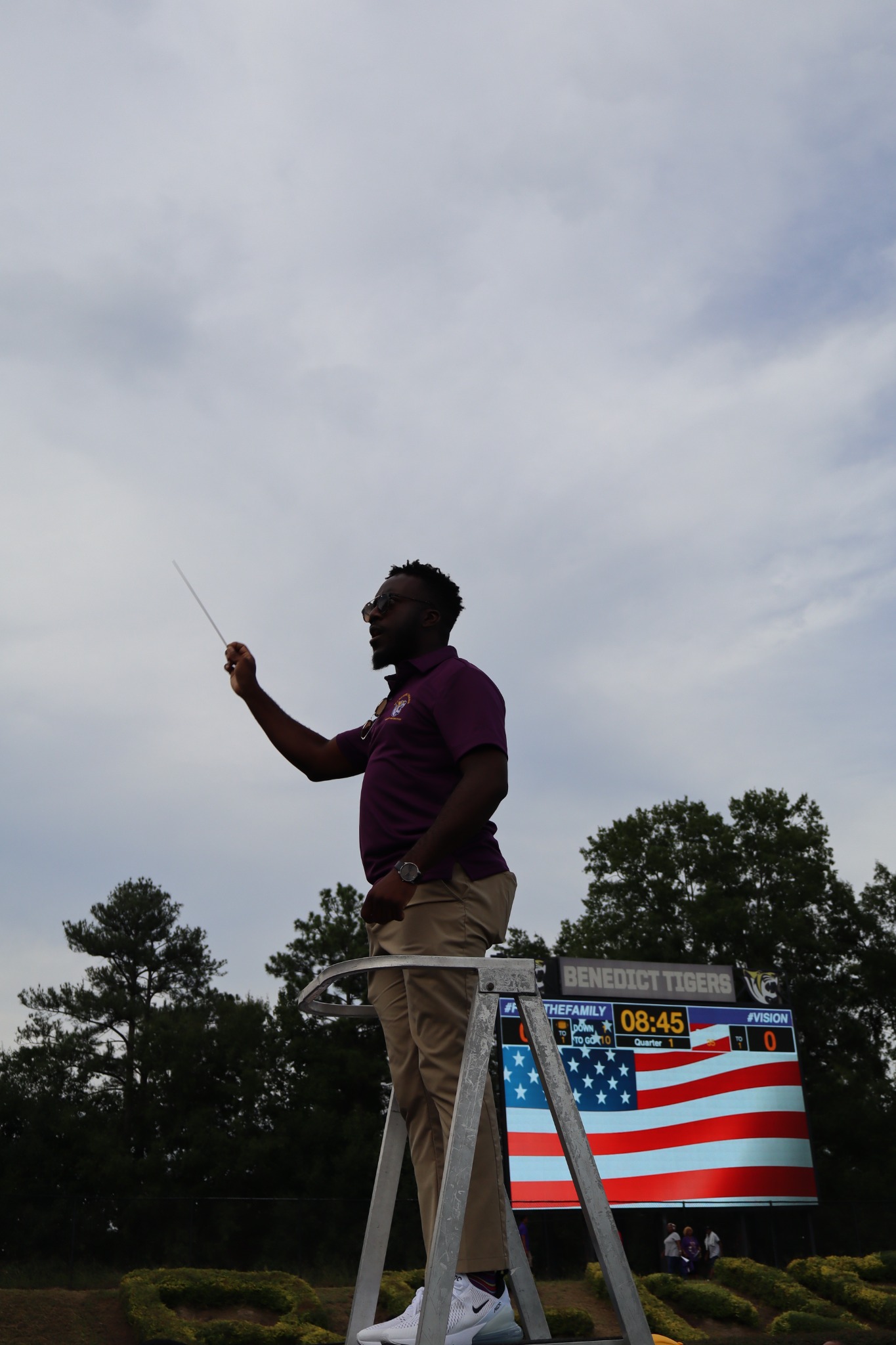 Band director photographed directing on the field at Benedict College