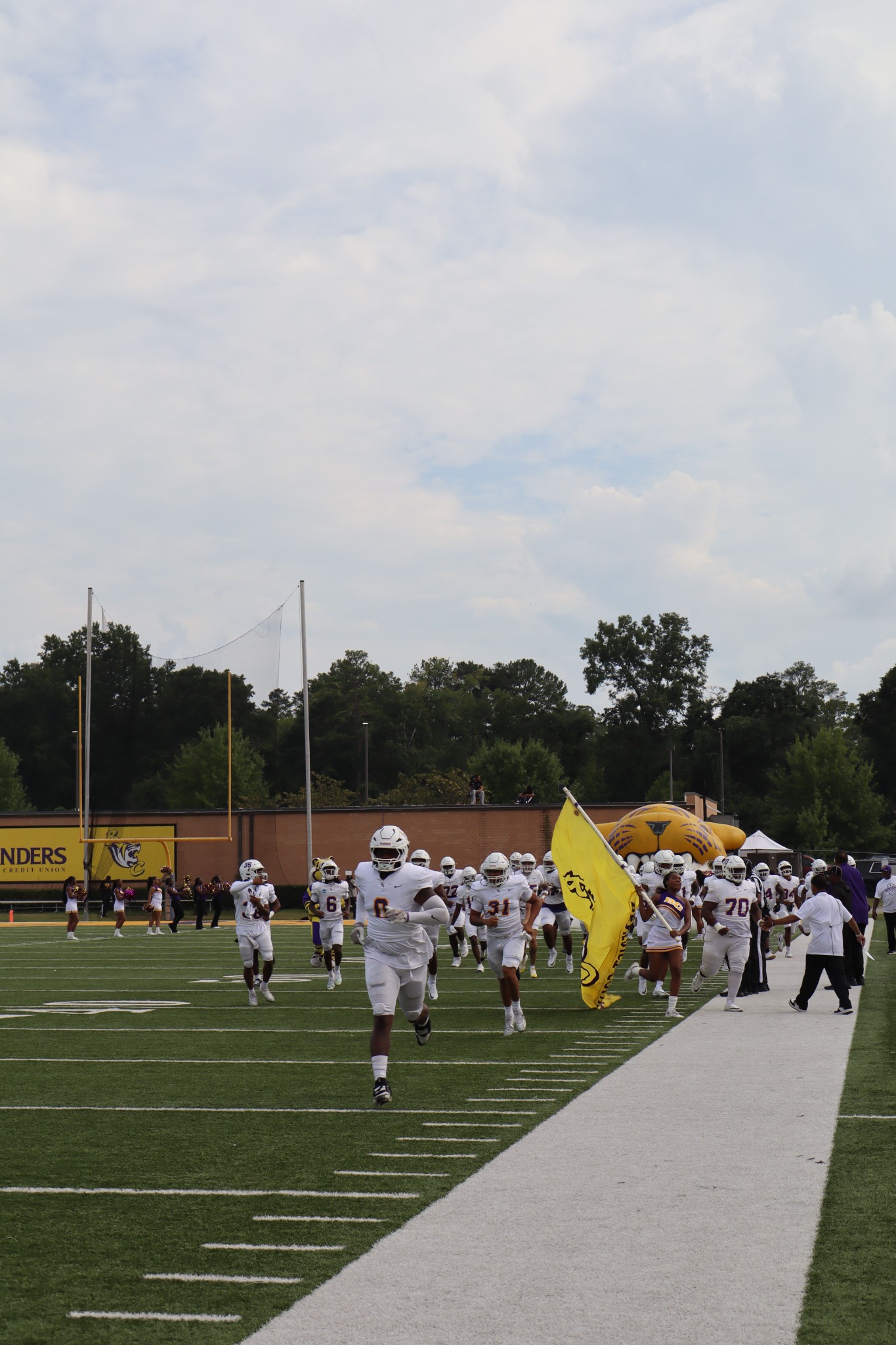 Football team running onto the field
